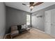 Relaxing bedroom with a window for natural light, neutral walls, and cozy seating area at 609 Woodson Dr, Clayton, NC 27527