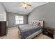 Comfortable bedroom with a ceiling fan, soft lighting, and ample space for relaxation at 609 Woodson Dr, Clayton, NC 27527