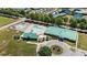 Aerial view showcasing the community pool, clubhouse, and surrounding landscape at 609 Woodson Dr, Clayton, NC 27527