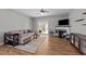 Bright living room with a ceiling fan, modern fireplace, and sliding glass doors to the deck for indoor-outdoor living at 609 Woodson Dr, Clayton, NC 27527