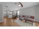 Open living room boasts natural light, modern ceiling fan, and seamless flow into the dining area at 609 Woodson Dr, Clayton, NC 27527