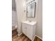 Bathroom with a white sink vanity and framed mirror at 6579 Sidney Cottrell Rd, Oxford, NC 27565