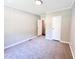 Bedroom with neutral colored walls, carpeting, and closet visible at 6579 Sidney Cottrell Rd, Oxford, NC 27565