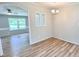 Dining room boasts modern flooring and a view into the living room, creating an open concept at 6579 Sidney Cottrell Rd, Oxford, NC 27565