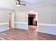 Bright living room showcasing open layout, modern flooring, and a view into the kitchen at 6579 Sidney Cottrell Rd, Oxford, NC 27565