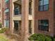 Brick apartment building with private balconies offers residents their own outdoor retreats at 700 Finsbury St # 105, Durham, NC 27703