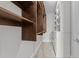 Organized walk-in closet with built-in shelves and drawers offering ample storage space at 700 Finsbury St # 105, Durham, NC 27703