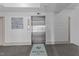 Modern elevator with stainless steel doors in a well-maintained lobby area at 700 Finsbury St # 105, Durham, NC 27703