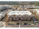 Aerial view of a well-maintained four-story brick apartment complex at 700 Finsbury St # 105, Durham, NC 27703
