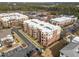 Aerial of modern apartment buildings with ample parking and landscaping at 700 Finsbury St # 105, Durham, NC 27703