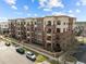 Low aerial angle shows the well maintained apartment building with detailed brickwork at 700 Finsbury St # 105, Durham, NC 27703