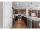 Kitchen featuring stainless steel appliances, granite countertops, wood floors, and custom cabinets at 700 Finsbury St # 105, Durham, NC 27703
