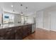 Modern kitchen island with granite countertops, stainless steel appliances, and natural light at 700 Finsbury St # 105, Durham, NC 27703