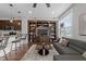 Open floor plan featuring a modern living area, kitchen with bar seating, and custom built-ins at 700 Finsbury St # 105, Durham, NC 27703