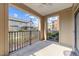 A cozy outdoor patio with a ceiling fan offers a relaxing spot to enjoy the neighborhood view at 700 Finsbury St # 105, Durham, NC 27703