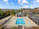 Aerial view of a community pool with a shaded pavilion and ample seating at 700 Finsbury St # 105, Durham, NC 27703