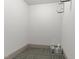 Organized storage area with shelving units, carpet, and space for various household items at 700 Finsbury St # 105, Durham, NC 27703
