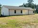 Newly constructed home with vinyl siding and a spacious backyard ready for landscaping and outdoor activities at 71 Earnest Way, Kenly, NC 27542