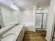 Bathroom featuring a double vanity, separate tub and shower, and modern fixtures at 71 Earnest Way, Kenly, NC 27542