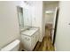 Bathroom vanity featuring granite countertop and sleek fixtures complemented by wood-look flooring at 71 Earnest Way, Kenly, NC 27542