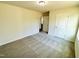 Bedroom featuring neutral carpeting and a door, creating a relaxing and inviting atmosphere at 71 Earnest Way, Kenly, NC 27542