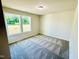 Well-lit bedroom featuring natural lighting from large windows providing picturesque outdoor views at 71 Earnest Way, Kenly, NC 27542