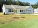 Inviting home showcasing a well-manicured lawn and charming facade at 71 Earnest Way, Kenly, NC 27542