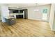 Bright, open kitchen with gray cabinetry, an island, and stainless steel appliances at 71 Earnest Way, Kenly, NC 27542