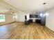 Spacious kitchen with wood floors, gray cabinetry, a center island, and ample counter space at 71 Earnest Way, Kenly, NC 27542