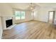 Bright living room with a fireplace, vaulted ceilings, and plenty of natural light at 71 Earnest Way, Kenly, NC 27542