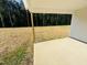 Covered patio with concrete flooring featuring a large open backyard, perfect for outdoor enjoyment at 71 Earnest Way, Kenly, NC 27542