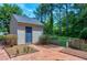Backyard featuring a shed with adjacent patio and landscaping for outdoor enjoyment at 7204 Bellweather N Ct, Raleigh, NC 27615