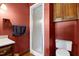 A bathroom showcasing a glass shower, stylish wallpaper, and a single sink vanity at 7204 Bellweather N Ct, Raleigh, NC 27615