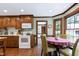 Bright and airy breakfast nook with hardwood floors, large windows, and traditional trim, ideal for morning meals at 7204 Bellweather N Ct, Raleigh, NC 27615
