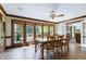 Bright dining room with large windows, natural light, and hardwood flooring, perfect for Gathering gatherings at 7204 Bellweather N Ct, Raleigh, NC 27615