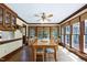 Charming dining room with hardwood floors, abundant natural light, and classic trim, ideal for Gathering meals at 7204 Bellweather N Ct, Raleigh, NC 27615