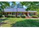Classic brick home with well-maintained lawn and landscaping at 7204 Bellweather N Ct, Raleigh, NC 27615