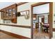 Cozy breakfast nook off the kitchen featuring built-in cabinets and hardwood flooring, bathed in natural light at 7204 Bellweather N Ct, Raleigh, NC 27615