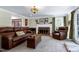 Comfortable living room with a brick fireplace and hardwood floors exudes classic charm at 7204 Bellweather N Ct, Raleigh, NC 27615