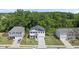 Aerial view of a well maintained, two-story home, complemented by lush greenery and neighborhood at 77 Rolling Creek Cir, Clayton, NC 27520