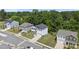 Aerial view of homes in a neighborhood with mature trees and well-kept lawns at 77 Rolling Creek Cir, Clayton, NC 27520