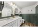 Stylish bathroom with double sink vanity, modern fixtures, and updated design elements at 77 Rolling Creek Cir, Clayton, NC 27520