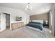 Spacious main bedroom showing decorative accent wall and recessed ceiling lights at 77 Rolling Creek Cir, Clayton, NC 27520