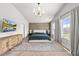 An impressive main bedroom showcasing a lovely decorative wall and eye-catching lighting at 77 Rolling Creek Cir, Clayton, NC 27520