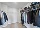 Walk-in closet featuring ample shelving and hanging storage at 77 Rolling Creek Cir, Clayton, NC 27520