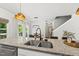 Kitchen island with granite counters and stainless sink at 77 Rolling Creek Cir, Clayton, NC 27520