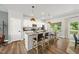 Beautiful kitchen with a granite island, pendant lighting, and modern white cabinetry at 77 Rolling Creek Cir, Clayton, NC 27520