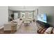Bright living room showcasing a plush sectional, large windows, and stylish decor at 77 Rolling Creek Cir, Clayton, NC 27520