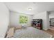 Bright playroom featuring a window view, playful decor, and a patterned rug at 77 Rolling Creek Cir, Clayton, NC 27520