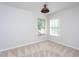This bedroom features neutral paint, carpet, and two bright windows to allow natural light at 802 Wakehurst Dr, Cary, NC 27519